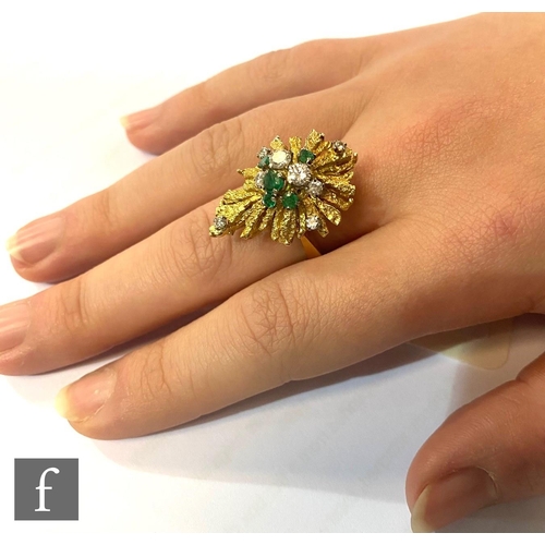 477 - A 1970s 18ct emerald and diamond cluster ring, thirteen individually claw set stones, five emeralds ... 