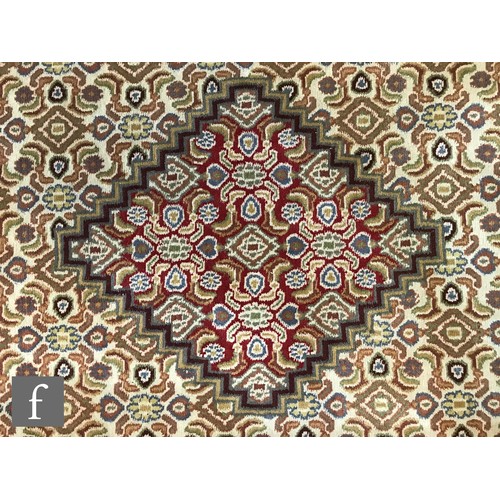 975 - An very large Bidjar carpet, the hand knotted wool rug with central diamond design, within a series ... 