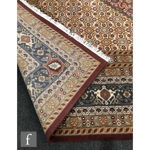 975 - An very large Bidjar carpet, the hand knotted wool rug with central diamond design, within a series ... 