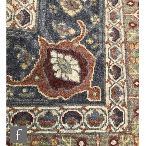 975 - An very large Bidjar carpet, the hand knotted wool rug with central diamond design, within a series ... 