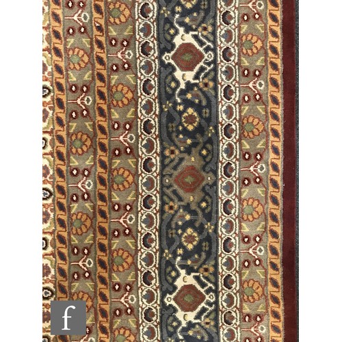 975 - An very large Bidjar carpet, the hand knotted wool rug with central diamond design, within a series ... 