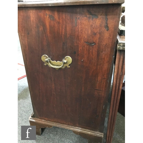 1243 - A George III style mahogany serpentine chest of three long drawers below a leather inset brushing sl... 