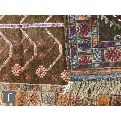 1235 - Two Turkish kilim rugs, the first a Mut example on a red coloured ground, 233cm x 124cm, and the sec... 