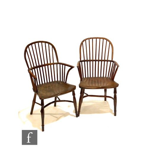 1247 - A near pair of 19th Century yew wood and ash stick back Windsor elbow chairs on splayed baluster uni... 