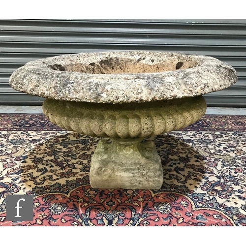 1246 - A late 20th Century composite stone half fluted terrace vase or urn, on moulded plinth base, width 7... 