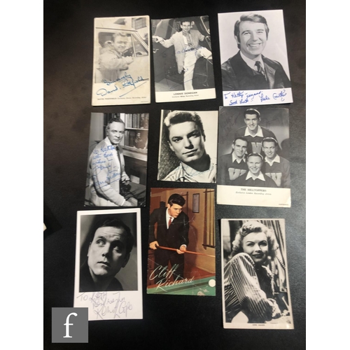 86 - A collection of autographed photographs and postcards, artists to include Max Bygraves, Freddie and ... 