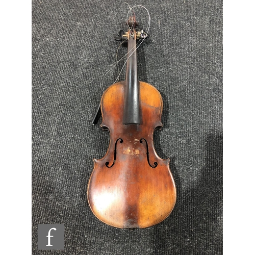 943 - A late 19th to early 20th Century violin with spruce sound board and one piece maple back, bearing s... 