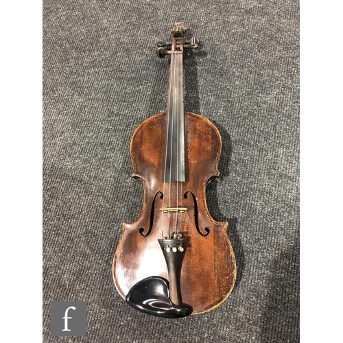 943 - A late 19th to early 20th Century violin with spruce sound board and one piece maple back, bearing s... 