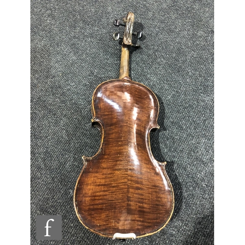 943 - A late 19th to early 20th Century violin with spruce sound board and one piece maple back, bearing s... 