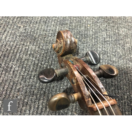 943 - A late 19th to early 20th Century violin with spruce sound board and one piece maple back, bearing s... 