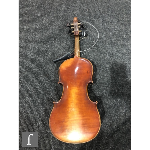 943 - A late 19th to early 20th Century violin with spruce sound board and one piece maple back, bearing s... 