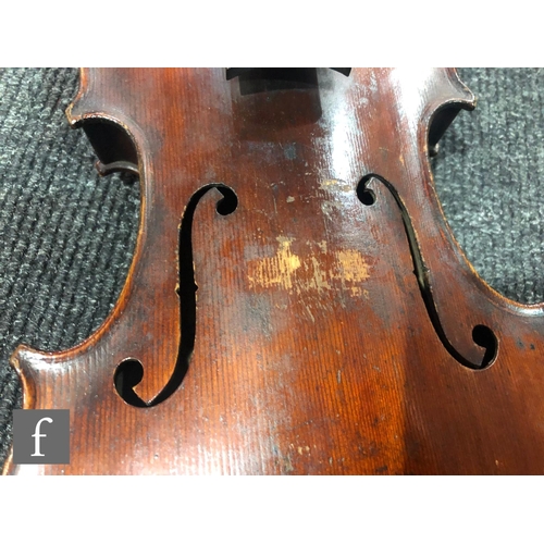 943 - A late 19th to early 20th Century violin with spruce sound board and one piece maple back, bearing s... 