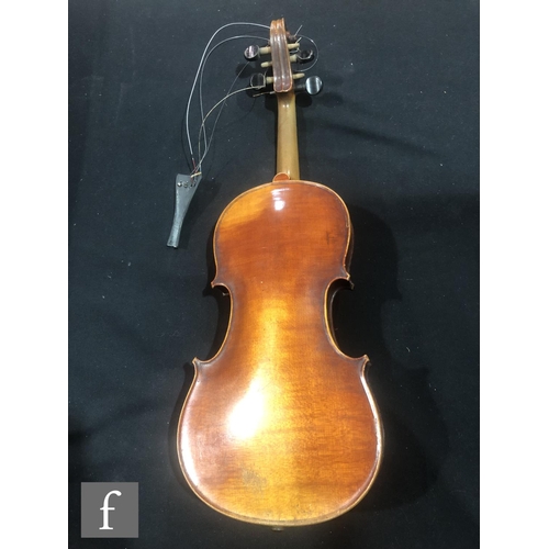 943 - A late 19th to early 20th Century violin with spruce sound board and one piece maple back, bearing s... 