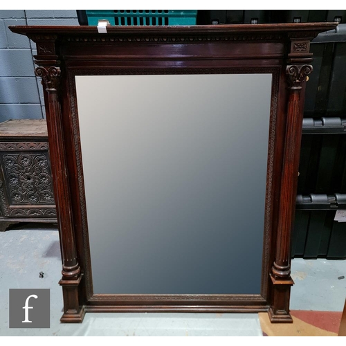 1042 - A large Edwardian mahogany classical style overmantel mirror, the bevelled plate flanked by a pair o... 