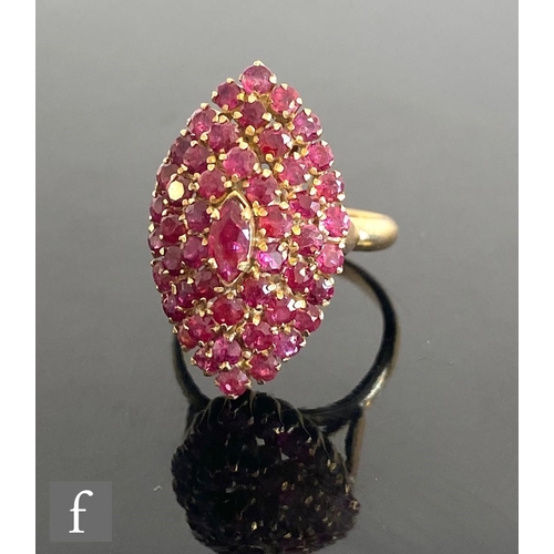 684 - A 14ct ruby cluster ring, a four tier target head to plain shoulders, total weight 6.5g, ring size N... 