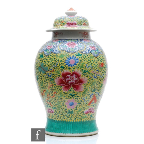 207 - A Chinese famille rose jar and cover, of baluster form surmounted by a domed rim cover, the body dec... 