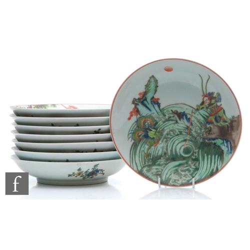 225 - A set of eight Chinese famille verte dishes, each of circular form, the shallow well of each decorat... 