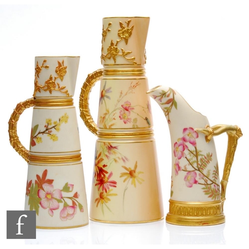 26 - Two late 19th Century Royal Worcester blush ivory conical ewers each decorated with sprays of flower... 