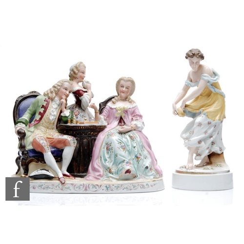 36 - A 20th Century figural group modelled as a lady and gentleman playing chess with a maid in attendanc... 