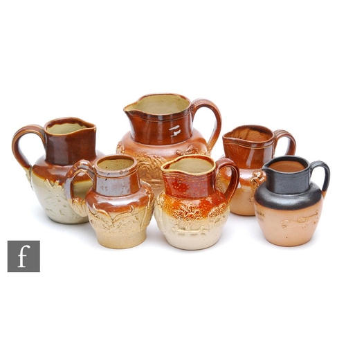 56 - Six small late 19th and early 20th Century salt glazed stoneware jugs of varying form each decorated... 