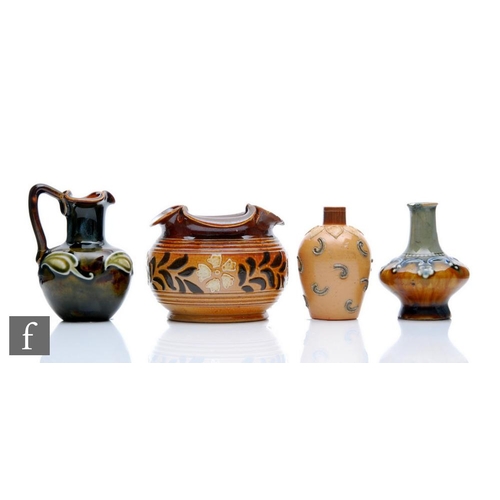 59 - Four small pieces of Royal Doulton comprising two small vases, a jug and a cache pot, all with raise... 