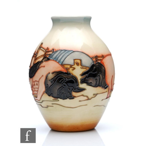 9 - A Moorcroft Pottery vase in the Limousin Pig pattern designed by Kerry Goodwin, of footed ovoid form... 