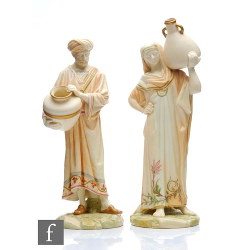 93 - A pair of late 19th Century Royal Worcester blush ivory figures of Egyptian water carriers modelled ... 