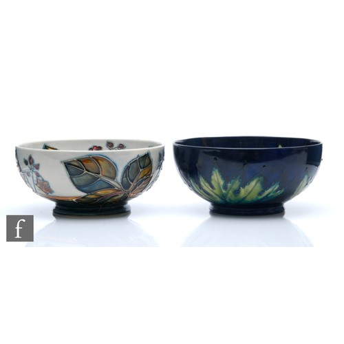 101 - Two Moorcroft Pottery footed bowls, the first decorated in the Buttercup pattern, the second in the ... 