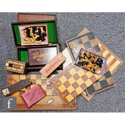 942 - Three wooden chess boards, two complete boxwood chess sets, a Romanesque chess set, a Cribbage board... 