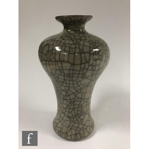 231 - A Chinese Guan type meiping vase, the pale grey/celadon ground with dark lines and unglazed footrim,... 