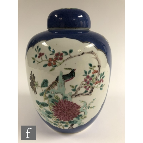 195 - A Chinese Powder Blue porcelain vase of rounded ovoid form, the exterior sides picked out with fan s... 