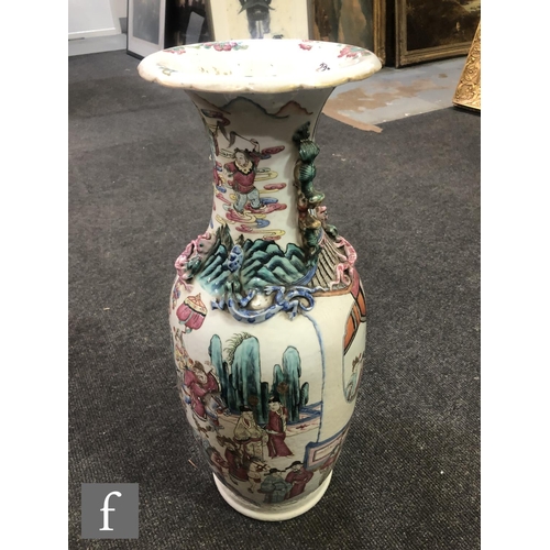 227 - A Chinese 19th Century Canton famille rose vase of baluster form, the neck extending to a flared and... 