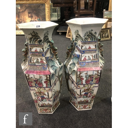 228 - A pair of Chinese 19th Century Canton famille rose vases, each of hexagonal form, rising from a high... 