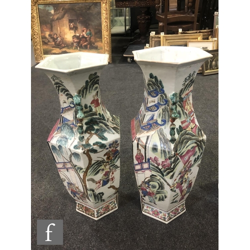 228 - A pair of Chinese 19th Century Canton famille rose vases, each of hexagonal form, rising from a high... 