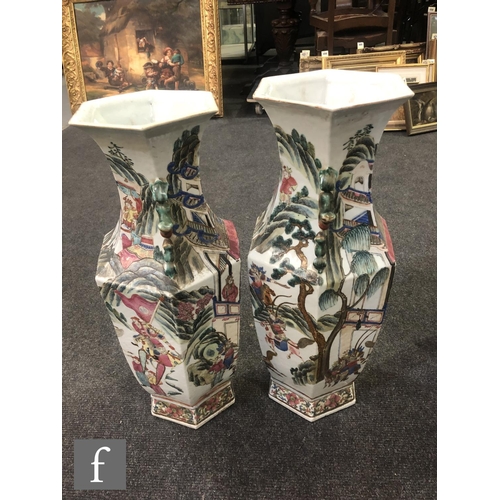 228 - A pair of Chinese 19th Century Canton famille rose vases, each of hexagonal form, rising from a high... 