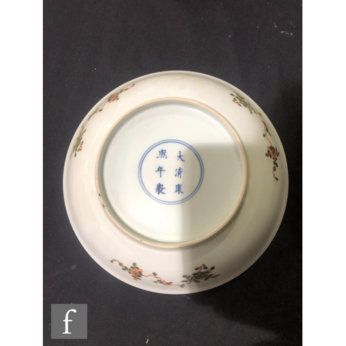 225 - A set of eight Chinese famille verte dishes, each of circular form, the shallow well of each decorat... 