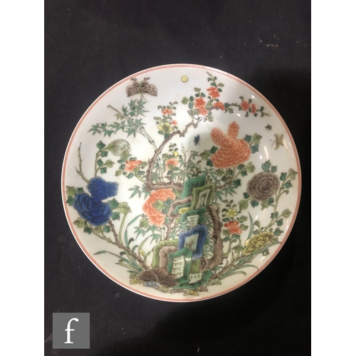 225 - A set of eight Chinese famille verte dishes, each of circular form, the shallow well of each decorat... 