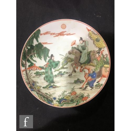 225 - A set of eight Chinese famille verte dishes, each of circular form, the shallow well of each decorat... 