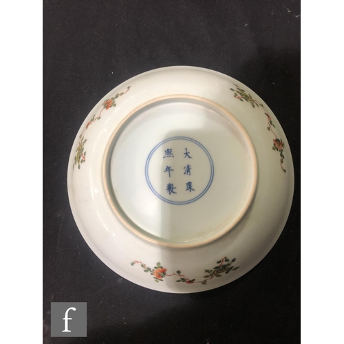 225 - A set of eight Chinese famille verte dishes, each of circular form, the shallow well of each decorat... 