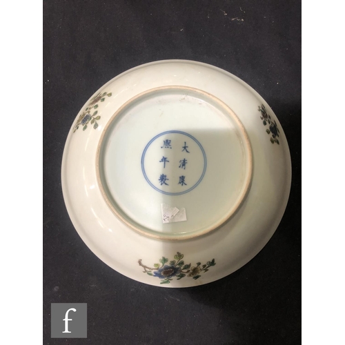 225 - A set of eight Chinese famille verte dishes, each of circular form, the shallow well of each decorat... 