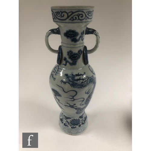 210 - Two Chinese blue and white porcelain vases, each of bottle form decorated with Qilin and dragon, bef... 