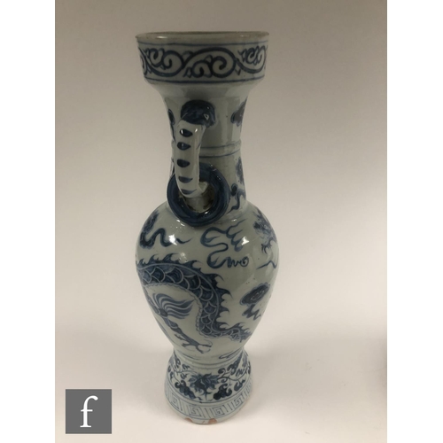 210 - Two Chinese blue and white porcelain vases, each of bottle form decorated with Qilin and dragon, bef... 