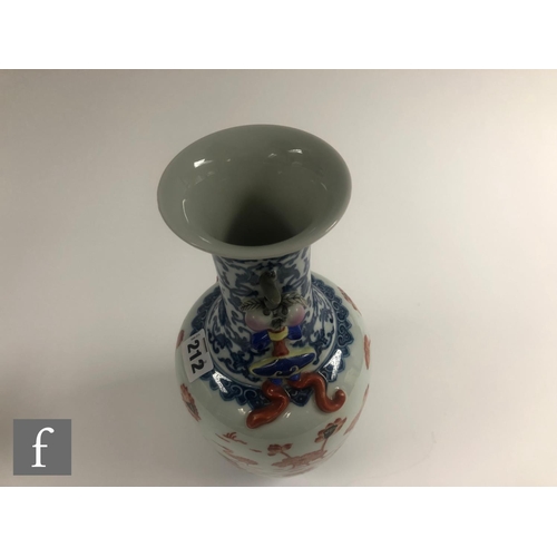 212 - A Chinese blue and white porcelain vase of bottle form applied with iron-red enamels to the central ... 