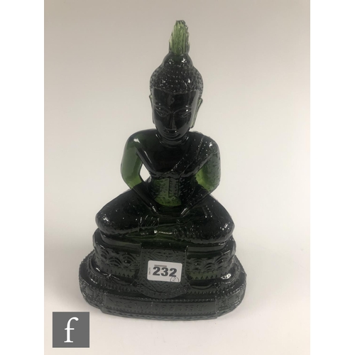 232 - A Chinese green pressed moulded glass figure of Buddha, seated in dhyanasana atop a pedestal base, h... 