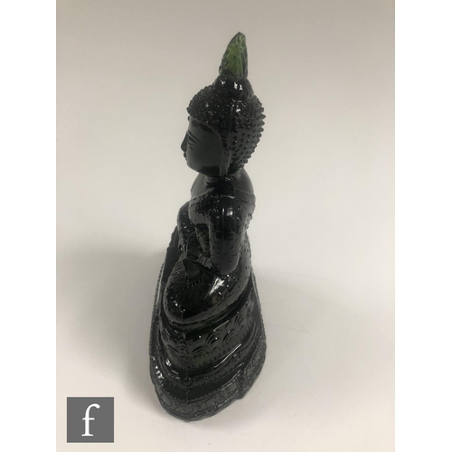 232 - A Chinese green pressed moulded glass figure of Buddha, seated in dhyanasana atop a pedestal base, h... 