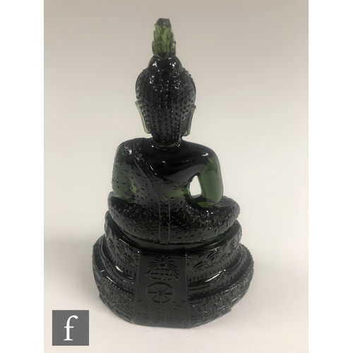 232 - A Chinese green pressed moulded glass figure of Buddha, seated in dhyanasana atop a pedestal base, h... 