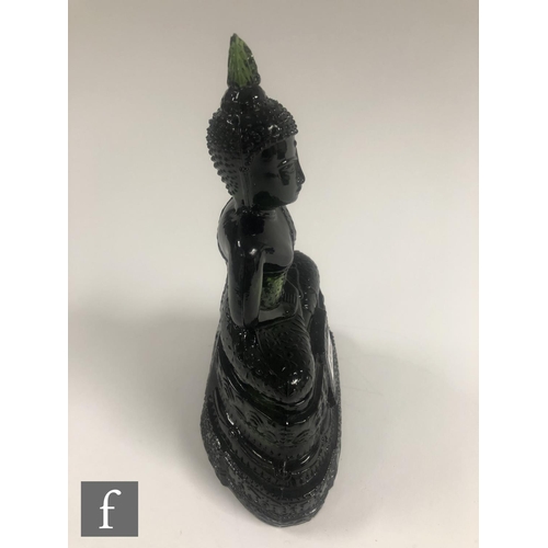 232 - A Chinese green pressed moulded glass figure of Buddha, seated in dhyanasana atop a pedestal base, h... 