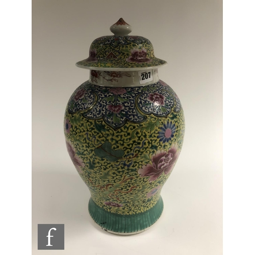 207 - A Chinese famille rose jar and cover, of baluster form surmounted by a domed rim cover, the body dec... 