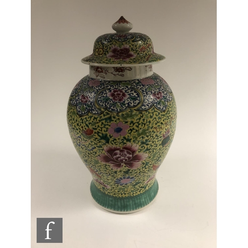 207 - A Chinese famille rose jar and cover, of baluster form surmounted by a domed rim cover, the body dec... 