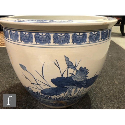 214 - A Chinese blue and white porcelain fish bowl, the large vessel decorated to the exterior with a cont... 